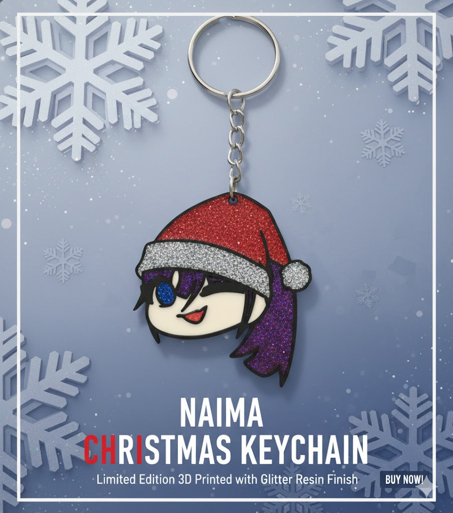 Porte-clé Naima Usseewa Ado version Noël, impression 3D multicouleur avec finition en résine époxy pailletée.